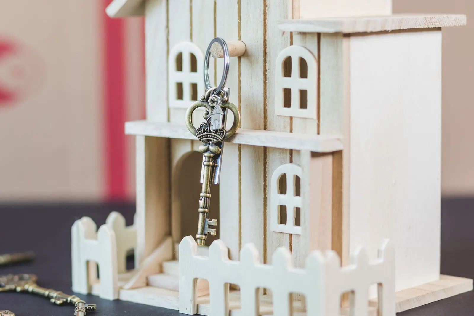 Small wooden house model with keys